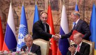 Ukrainian Infrastructure Minister Oleksandr Kubrakov and Turkish Defence Minister Hulusi Akar shake hands next to UN Secretary-General Antonio Guterres and Turkish President Recep Tayyip Erdogan during a signing ceremony in Istanbul, Turkey, July 22, 2022. (REUTERS/Umit Bektas)