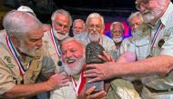 Jon Auvil, receives an Ernest Hemingway bust and congratulations after he won the 2022 Hemingway Look-Alike Contest, at Sloppy Joe's Bar in Key West, Florida, US July 23, 2022. (Reuters)