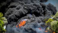A wildfire burns at the village of Krestena, in the western Peloponnese, Greece, July 24, 2022. (Giannis Spirounis/Eurokinissi via REUTERS)

