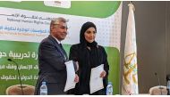 Chairperson of the NHRC H E Maryam bint Abdullah Al Attiyah and Chairman of the Algerian CNDH H E Abdel Majid Zaalani during the signing of the  memorandum.
