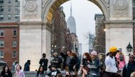File Photo: People wearing protective masks are seen in Washington Square park during the outbreak of the coronavirus disease in the Manhattan borough of New York City, March 25, 2021. (REUTERS/Jeenah Moo)
