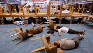 Supporters of Iraqi populist leader Moqtada al-Sadr sleep during a sit-in at the parliament building, amid political crisis in Baghdad, Iraq, August 3, 2022.(REUTERS/Ahmed Saad)