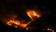 A wildfire burns at Bushat, Shkoder, Albania August 3, 2022. REUTERS/Florion Goga

