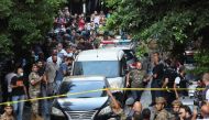 Vehicles are seen outside the Federal bank of Lebanon, after people who were held hostages exited the bank, in Hamra, Lebanon, August 11, 2022. (REUTERS/Mohamed Azakir)