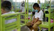 File Photo: Students attend a class in an elementary school in Pasay City, Metro Manila, Philippines, on December 6, 2021. (REUTERS/Lisa Marie David)