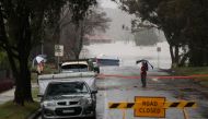 Floodwaters begin to recede after inundating a residential area, following heavy rains and severe flooding in the McGraths Hill suburb of Sydney, Australia, July 6, 2022. REUTERS/Loren Elliott/File Photo