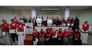 Officials with participants during the closing ceremony of the training course organised by the QRCS. 