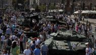 People attend an exhibition displaying destroyed Russian military vehicles located on the main street Khreshchatyk as part of the upcoming celebration of the Independence Day of Ukraine, amid Russia's invasion, in central Kyiv, Ukraine August 21, 2022. REUTERS/Gleb Garanich