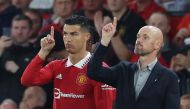Manchester United's Cristiano Ronaldo with manager Erik ten Hag before coming on as a substitute during the match against Liverpool at Old Trafford, Manchester, on August 22, 2022. Reuters 