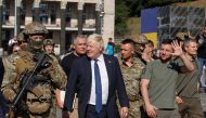 British Prime Minister Boris Johnson and Ukrainian President Volodymyr Zelenskiy walk at the Independence Square during an airstrike alarm, amid Russia's attack on Ukraine, in Kyiv, Ukraine on August 24, 2022. REUTERS/Valentyn Ogirenko
 