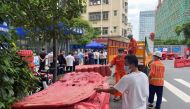 Workers set up barricades outside an entrance to Wanxia urban village as part of coronavirus disease (COVID-19) control measures in Shenzhen, Guangdong province, China August 29, 2022. REUTERS/David Kirton