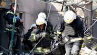 Emergency personnel work after the shelling of a private residential complex, in Mykolaiv, Ukraine, on August 29, 2022 in this picture obtained from social media. SES Ukraine/via REUTERS 