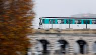 An elevated metro (or subway), operated by the Paris transport network (RATP), passes over a bridge in Paris, France, December 3, 2019. REUTERS/Charles Platiau/File Photo