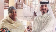 H E Ambassador Fatma Mohammed Rajab receiving a gift from Farhan Al Sheikh Al Sayed. 