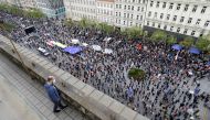 A man watches as demonstrators attend an anti-government protest in Prague, Czech Republic, on April 29, 2021. File Photo / Reuters
