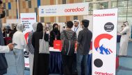 Ooredoo officials interact with students during the Career Fair.
