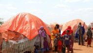 Civilians gather outside their makeshift shelters at the Kaxareey camp for the internally displaced people in Dollow, Gedo region of Somalia May 24, 2022. (REUTERS/Feisal Omar)