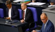 German Chancellor Olaf Scholz and Economy and Climate Minister Robert Habeck listen as Germany's Christian Democratic Union (CDU) party leader Friedrich Merz speaks during the budget debate in the lower house of parliament Bundestag in Berlin, Germany September 7, 2022. Reuters/Michele Tantussi