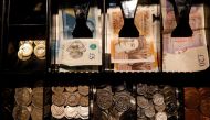Pound Sterling notes and change are seen inside a cash register in a coffee shop in Manchester, Britain, on September 21, 2018.  File Photo / Reuters