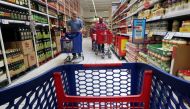 File Photo: People push shopping cart in a Carrefour supermarket in Cabrera de Mar, near Barcelona, Spain May 19, 2017. (REUTERS/Albert Gea)