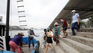 Vietnamese tourists visit Ha Long bay after the Vietnamese government eased the lockdown following the coronavirus disease (COVID-19) outbreak, in Quang Ninh province, Vietnam, May 19, 2020. REUTERS/Kham

