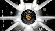 The Porsche logo is seen on a wheel of the 2020 Porsche 911 Speedster as it is revealed at the 2019 New York International Auto Show in New York City, New York, U.S, April 17, 2019. REUTERS/Brendan McDermid/File Photo