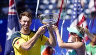 John Peers, left, and Storm Sanders, both of Australia, with the mixed doubles trophy of the 2022 U.S. Open tennis tournament at USTA Billie Jean King Tennis Center in Flushing, New York, on September 10, 2022.   Mandatory Credit: Danielle Parhizkaran-USA TODAY Sports
