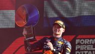 Red Bull's Max Verstappen celebrates with the trophy on the podium after winning the Italian Grand Prix at Autodromo Nazionale Monza, Monza, Italy, on September 11, 2022. (REUTERS/Jennifer Lorenzini)