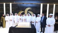 Dignitaries cutting a cake on the occasion.