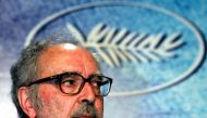 Swiss director Jean-Luc Godard listens to question during a press conference for his film entry 'Notre Musique' which is screened out of competition at the 57th Cannes Film Festival, May 18, 2004. Reuters/Vincent Kessler/File Photo