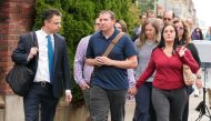 Family members of victims of the Sandy Hook Elementary School shooting arrive at the court house as Alex Jones faces a second defamation trial over Sandy Hook claims in Waterbury, Connecticut, on September 13, 2022. REUTERS/Michelle McLoughlin
