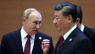 Russian President Vladimir Putin speaks with Chinese President Xi Jinping before an extended-format meeting of heads of the Shanghai Cooperation Organization summit (SCO) member states in Samarkand, Uzbekistan, on September 16, 2022. Sputnik/Sergey Bobylev/Pool via REUTERS 