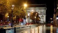 File Photo: A deserted Champs-Elysees avenue is seen near the Arc de Triomphe during the nightly curfew imposed to curb the spread of the coronavirus disease in Paris, France, on October 27, 2020. (REUTERS/Charles Platiau)