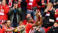 FC Union Berlin's Jordan Pefok (right) celebrates scoring their first goal with Christopher Trimmel during their German Bundesliga match against VfL Wolfsburg at the Stadion An der Alten Forsterei, Berlin, on September 18, 2022 1.  REUTERS/Fabrizio Bensch