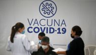 People wait in an observation room after receiving a dose of Pfizer-BioNTech coronavirus disease (Covid-19) vaccine at a vaccination center in San Salvador, El Salvador, on March 22, 2022. (REUTERS/Jose Cabezas)