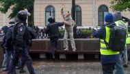 A Russian law enforcement officer detains a person during a rally, after opposition activists called for street protests against the mobilisation of reservists ordered by President Vladimir Putin, in Moscow on September 24, 2022. REUTERS/REUTERS PHOTOGRAPHER