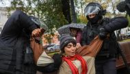 Russian law enforcement officers detain a person during a rally against the mobilisation of reservists ordered by President Vladimir Putin, in Moscow, Russia September 24, 2022. Reuters 