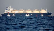 A liquefied natural gas (LNG) tanker is tugged towards a thermal power station in Futtsu, east of Tokyo, Japan November 13, 2017. REUTERS/Issei Kato/File Photo

