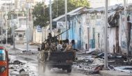 Somali security officers drive past a section of Hotel Hayat, the scene of an al Qaeda-linked al Shabaab group militant attack in Mogadishu, Somalia, on August 20, 2022. File Photo / Reuters
