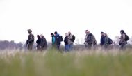 A soldier leads people during the 