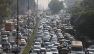 Vehicles queue at a traffic light on a hazy morning in New Delhi, India, October 16, 2020. REUTERS/Anushree Fadnavis/File Photo
