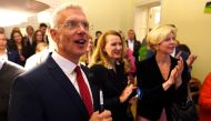 Latvian Prime Minister Arturs Krisjanis Karins reacts at 