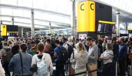 Passengers queue inside the departures terminal of Terminal 2 at Heathrow Airport in London, Britain, on June 27, 2022. (REUTERS/Henry Nicholls)