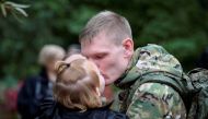 A Russian reservist bids farewell before his departure for a base in the course of partial mobilization of troops in the town of Volzhsky in the Volgograd region, Russia September 28, 2022. Reuters/Stringer/File Photo
 