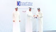 Minister of Labor H E Dr. Ali bin Smaikh Al Marri presents the award to Sheikh Abdulrahman bin Fahad Al Thani, Deputy Chief Executive Officer of Doha Bank, during the ceremony in Doha, recently. 
