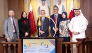 Abdul Aziz Nasser Al Emadi, Acting CEO of Qatar Stock Exchange, with Prof Dr. Rana Subuh, Dean of the College of Business and Economics at Qatar University, and Dr. Recep Şentürk, Dean of the College of Islamic Studies at HBKU, with other officials, during the bell ringing ceremony at the QSE trading floor, yesterday.