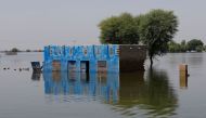A view shows a submerged building amid flood water, following rains and floods during the monsoon season in Talti town in Sehwan, Pakistan September 15, 2022. REUTERS/Akhtar Soomro