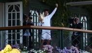 July 10, 2022 Serbia's Novak Djokovic celebrates with the trophy on the balcony after winning the men's singles final against Australia's Nick Kyrgios REUTERS/Matthew Childs/File Photo