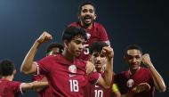 Qatar players celebrate.