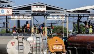 Tanker trucks are being filled with fuel at the Varreux fuel terminal for distribution after a group of Haitian gangs temporarily lifted a blockade leading to shortages, in Port-au-Prince, Haiti November 13, 2021. REUTERS
